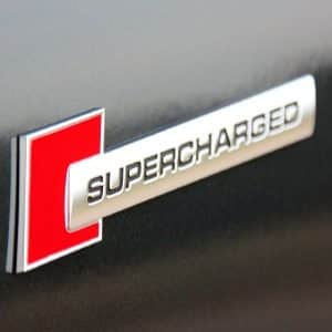 AVEX – Emblema auto model "SUPERCHARGED", reliefata 3D, dimensiune 10 x 1 cm